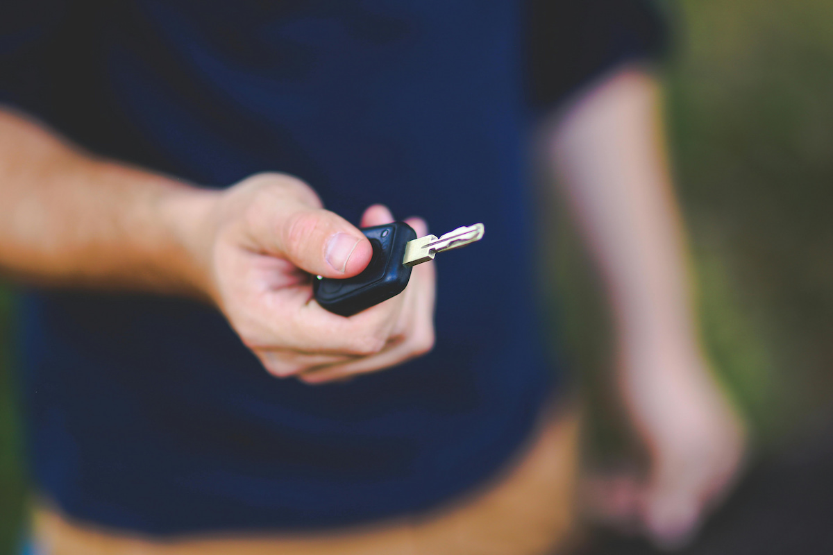 guy holding the car key